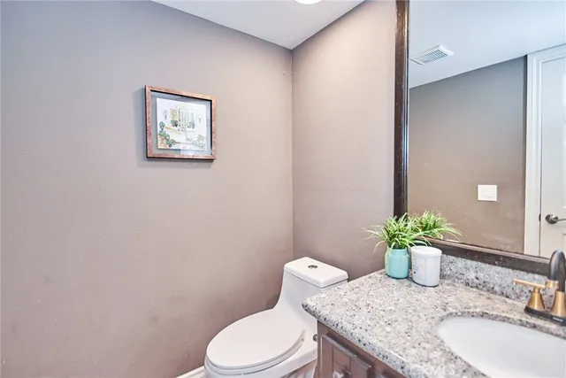 a view of a tables and chairs under an umbrella