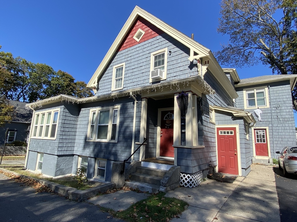a view of a house with brick walls