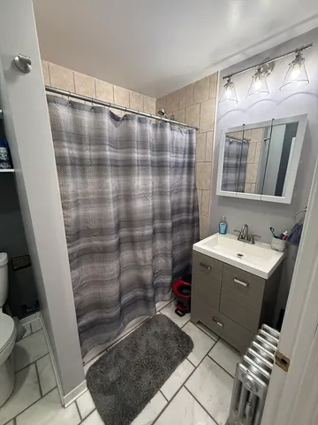 a bathroom with a sink and mirror