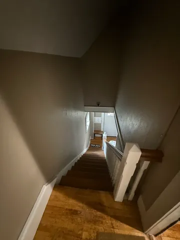 a view of staircase and rug