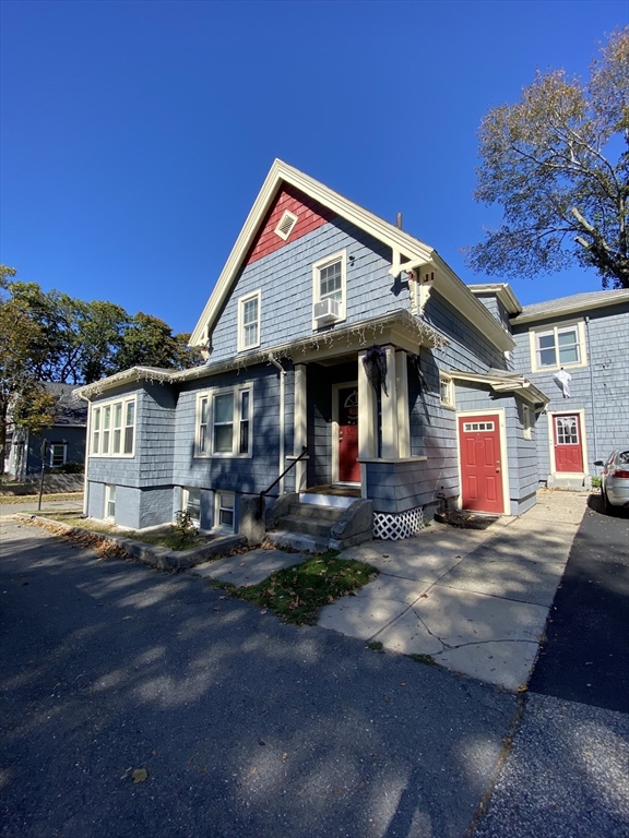 19 Oliver Street Worcester, MA 01603 - Photo 2 of 26 a front view of a house with garden