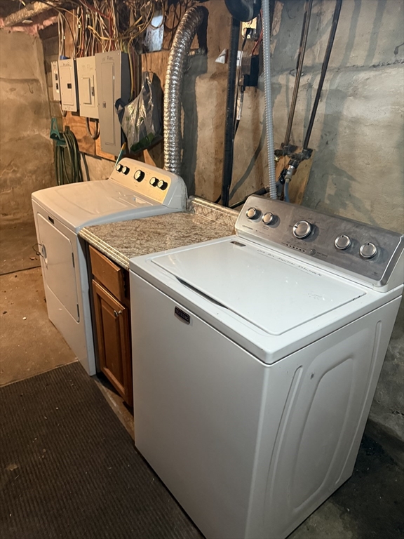 19 Oliver Street Worcester, MA 01603 - Photo 24 of 26 a utility room with dryer and washer
