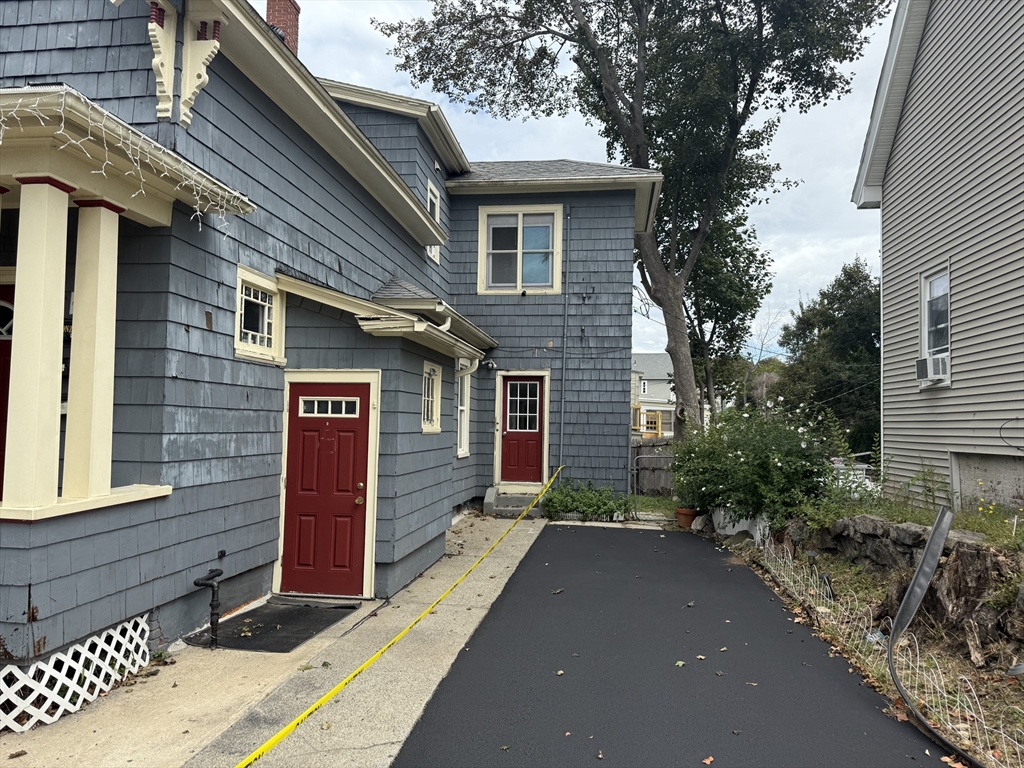19 Oliver Street Worcester, MA 01603 - Photo 5 of 26 a front view of a house with a yard
