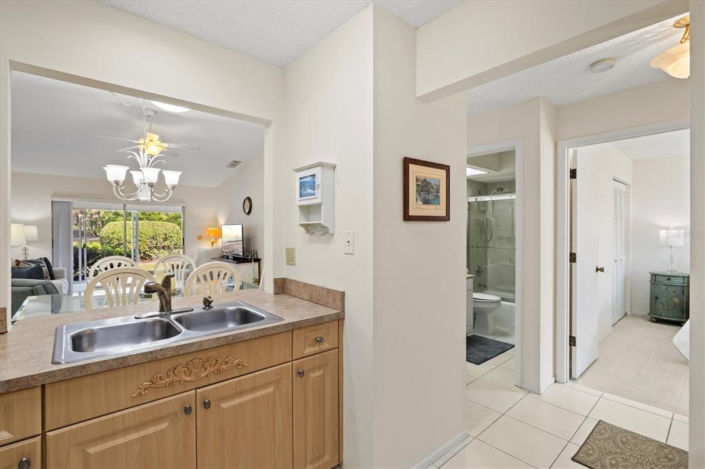 608 Pinebrook Crescent, Unit 8 Venice, FL 34285 - Photo 12 of 75 a bathroom with a sink and a mirror