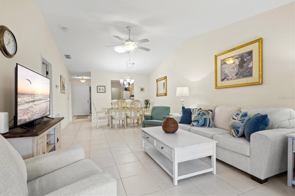 608 Pinebrook Crescent, Unit 8 Venice, FL 34285 - Photo 18 of 75 a living room with furniture and a flat screen tv