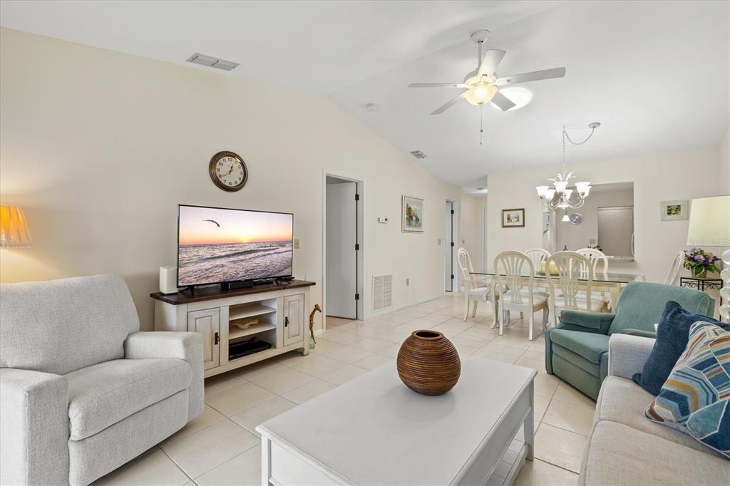 608 Pinebrook Crescent, Unit 8 Venice, FL 34285 - Photo 19 of 75 a living room with furniture and a flat screen tv