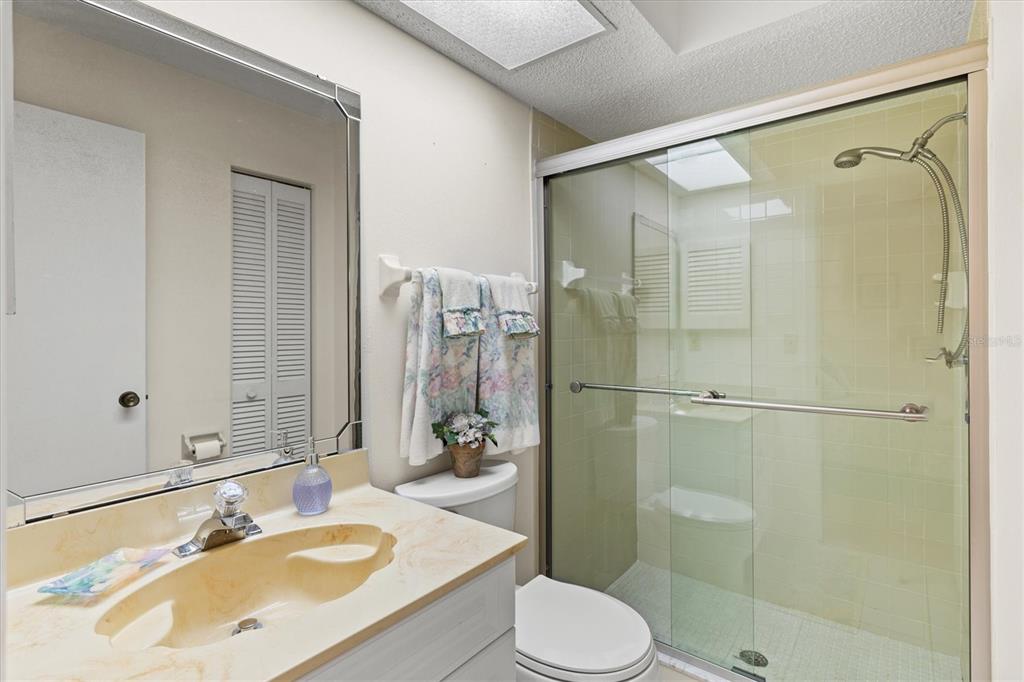 608 Pinebrook Crescent, Unit 8 Venice, FL 34285 - Photo 23 of 75 a bathroom with a sink toilet and shower