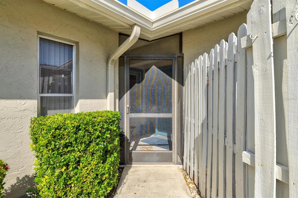 608 Pinebrook Crescent, Unit 8 Venice, FL 34285 - Photo 3 of 75 a front view of a house with a porch