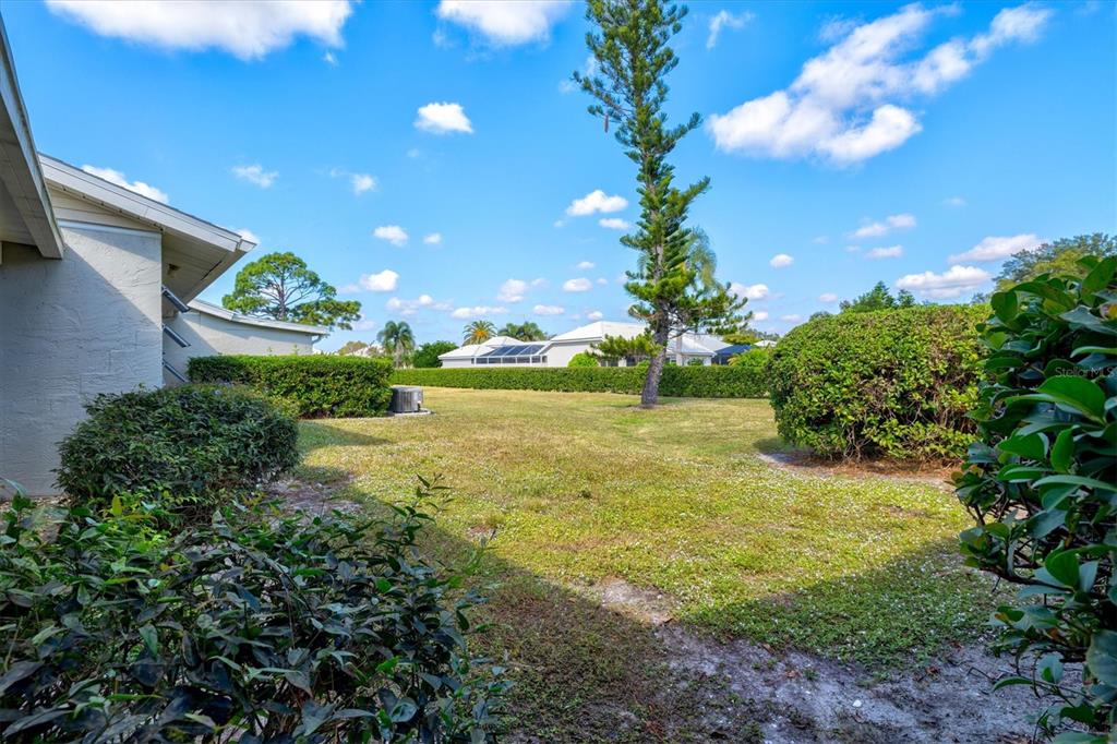 608 Pinebrook Crescent, Unit 8 Venice, FL 34285 - Photo 34 of 75 a view of a garden