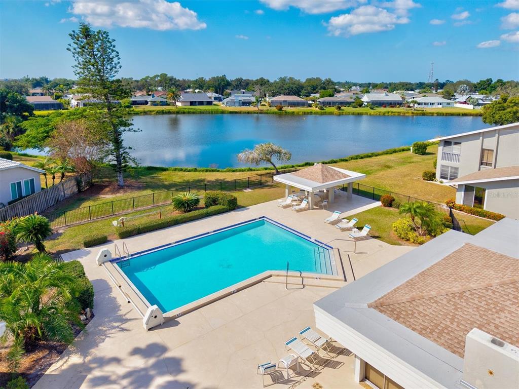 608 Pinebrook Crescent, Unit 8 Venice, FL 34285 - Photo 49 of 75 an aerial view of a house with a lake view
