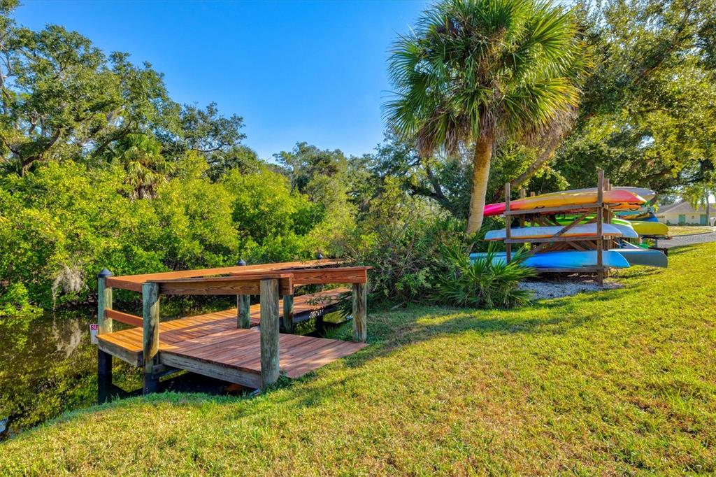 608 Pinebrook Crescent, Unit 8 Venice, FL 34285 - Photo 60 of 75 a front view of a house with swimming pool