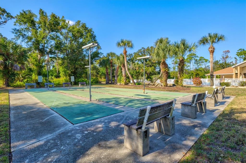608 Pinebrook Crescent, Unit 8 Venice, FL 34285 - Photo 63 of 75 a view of a swimming pool with a patio