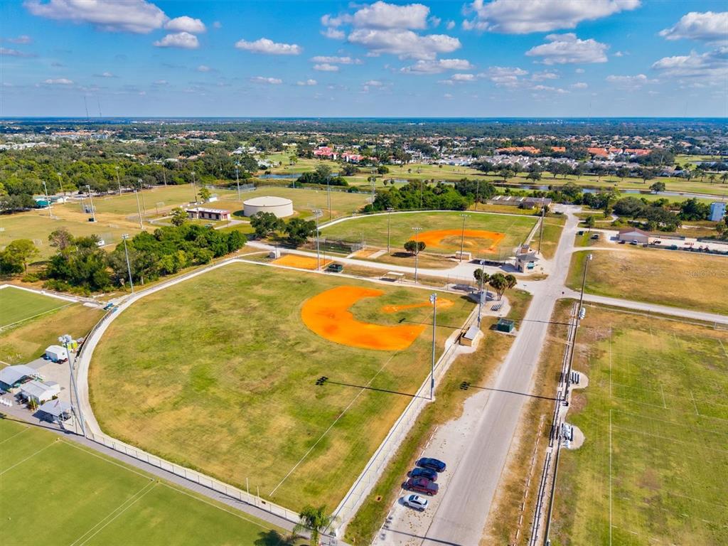 608 Pinebrook Crescent, Unit 8 Venice, FL 34285 - Photo 69 of 75 an aerial view of residential building with outdoor space