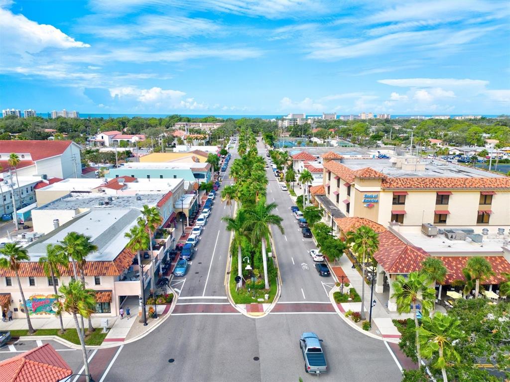 608 Pinebrook Crescent, Unit 8 Venice, FL 34285 - Photo 71 of 75 an aerial view of residential houses with outdoor space and ocean view