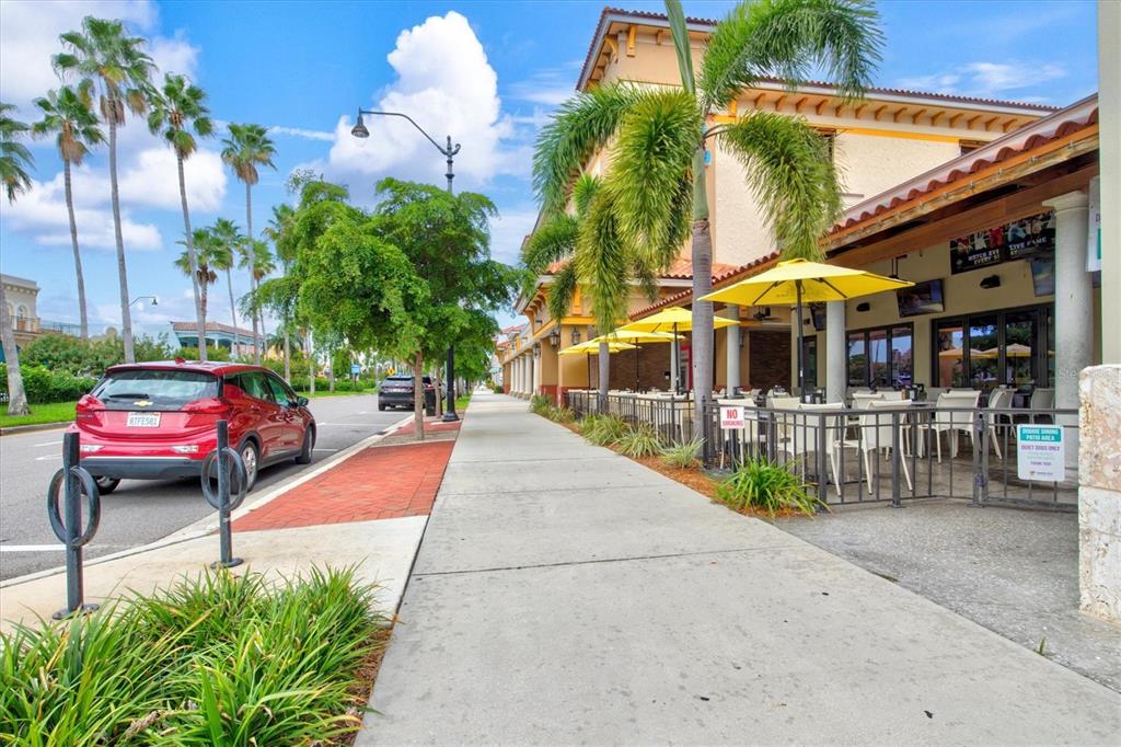 608 Pinebrook Crescent, Unit 8 Venice, FL 34285 - Photo 72 of 75 a view of multiple houses with a patio