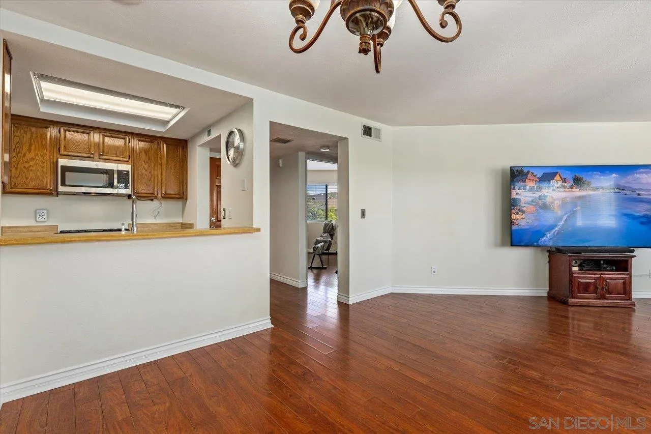 3003 Blue Oak Court Spring Valley, CA 91978 - Photo 12 of 39 a view of a livingroom with wooden floor and a chandelier