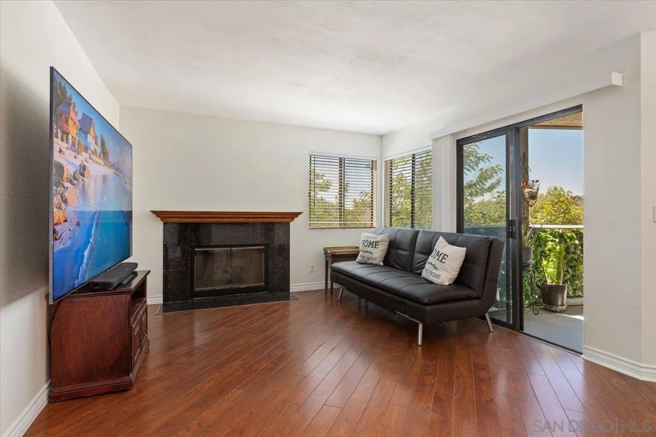 3003 Blue Oak Court Spring Valley, CA 91978 - Photo 14 of 39 a living room with furniture and a fireplace