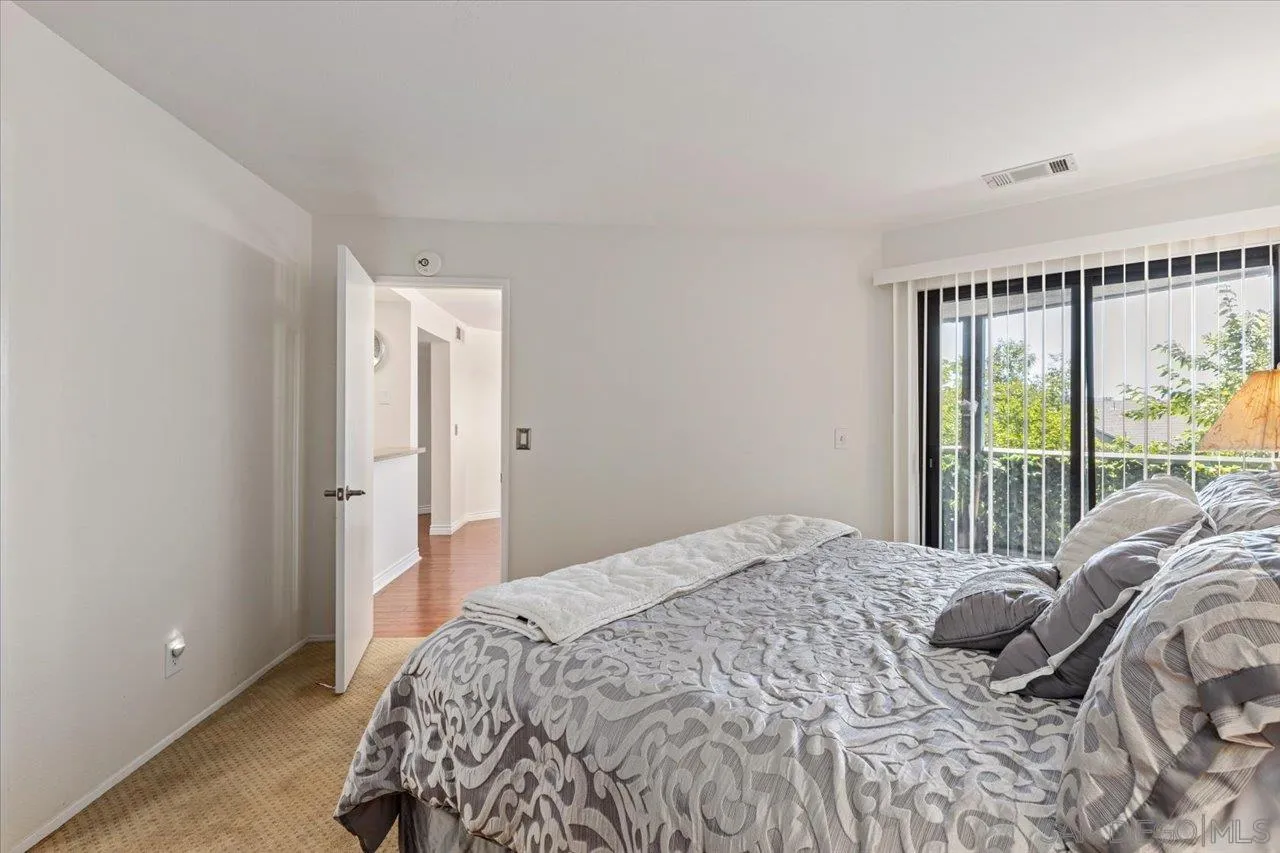 3003 Blue Oak Court Spring Valley, CA 91978 - Photo 21 of 39 a bedroom with a bed and a large window