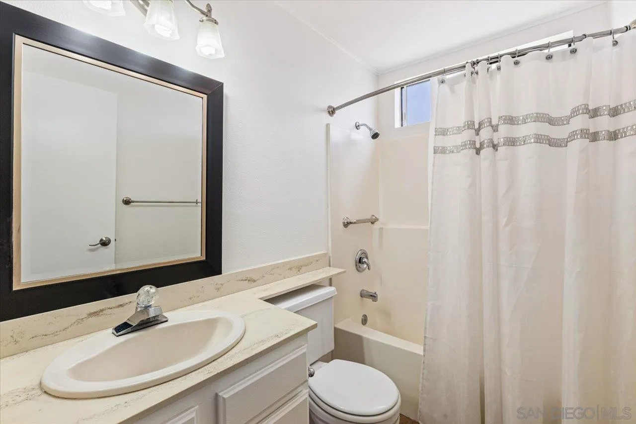 3003 Blue Oak Court Spring Valley, CA 91978 - Photo 27 of 39 a bathroom with a sink toilet and shower