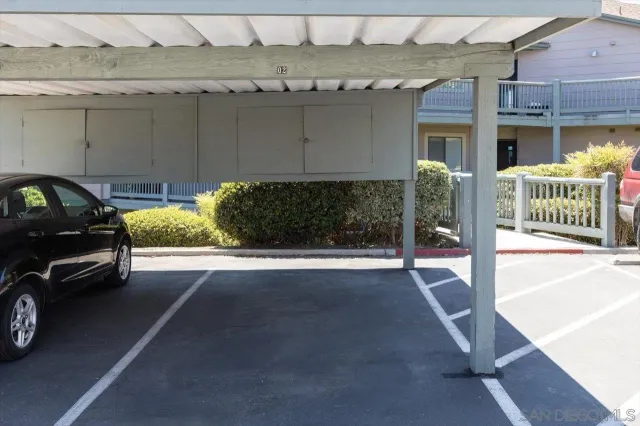 a view of a car parked in front of a building