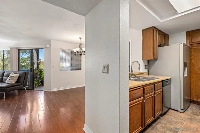 a kitchen with a refrigerator stove and sink