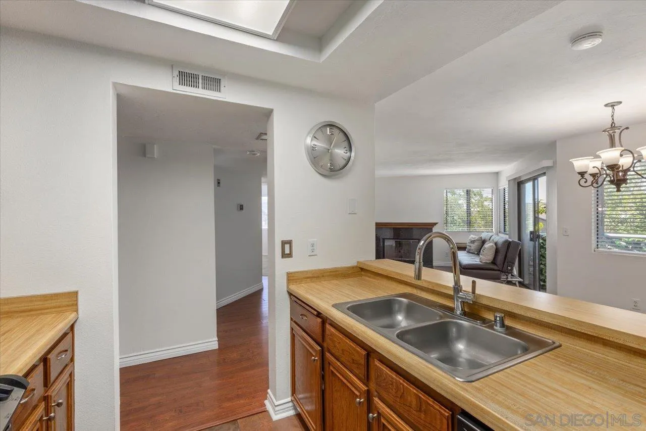 3003 Blue Oak Court Spring Valley, CA 91978 - Photo 10 of 39 a kitchen with a sink and a refrigerator
