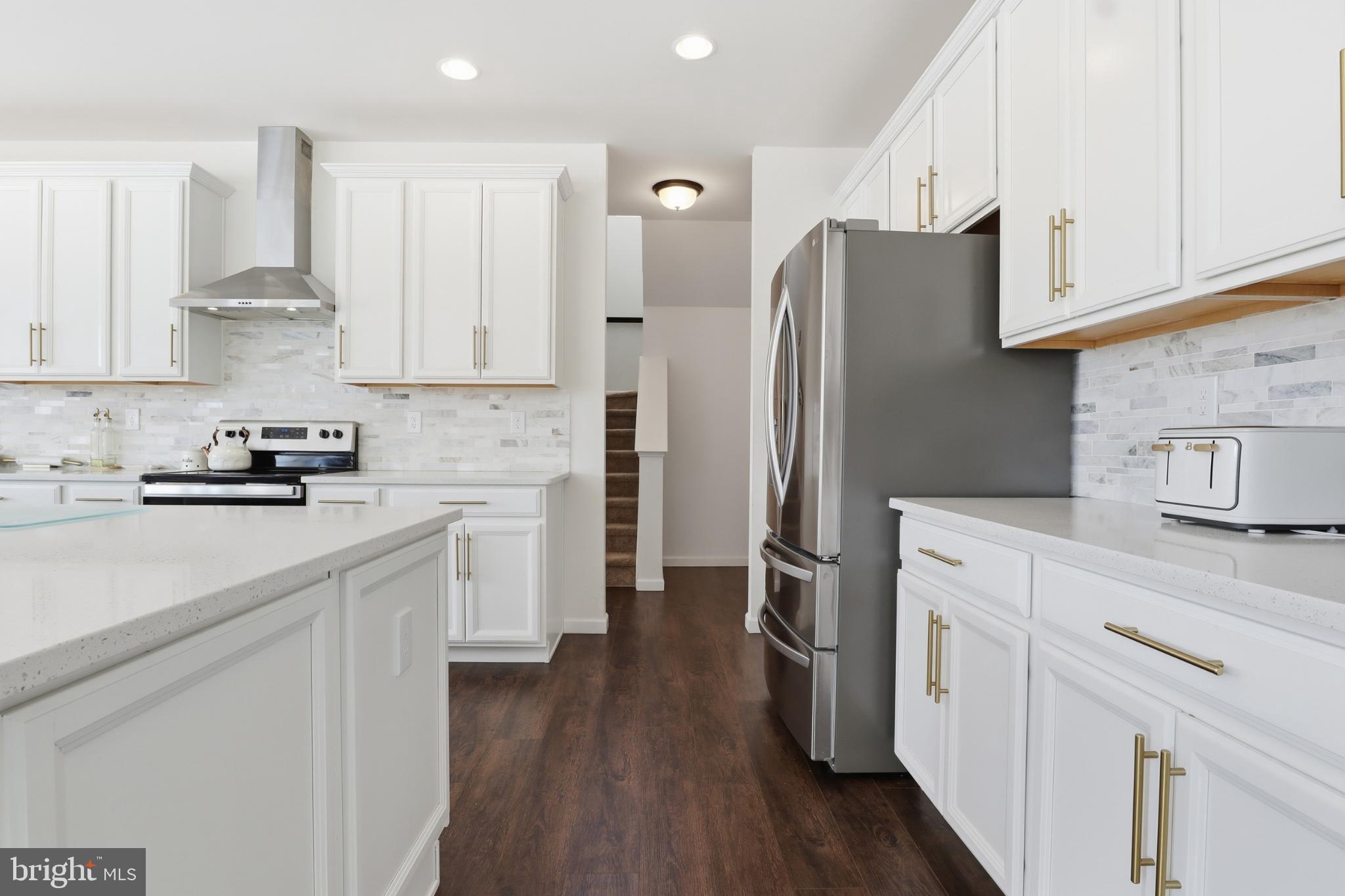 520 Darrow Road York, PA 17404 - Photo 14 of 35 Modern kitchen with sleek white cabinetry.