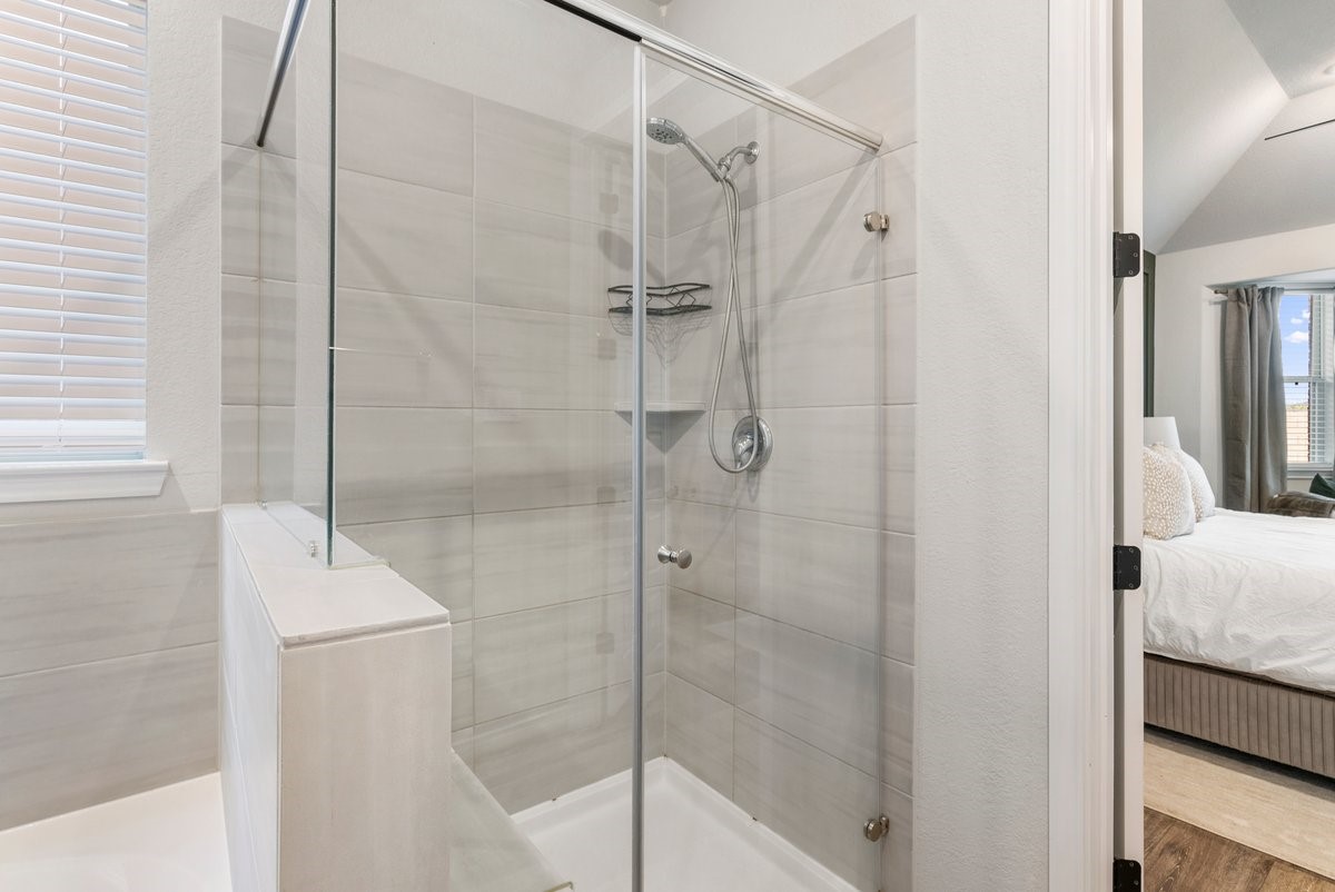 1702 Darwin Cedar Drive Rosharon, TX 77583 - Photo 26 of 44 The glass enclosure highlights the stunning tiled shower!