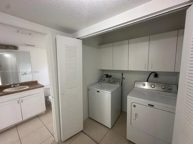 a view of a storage & utility room with washer and dryer