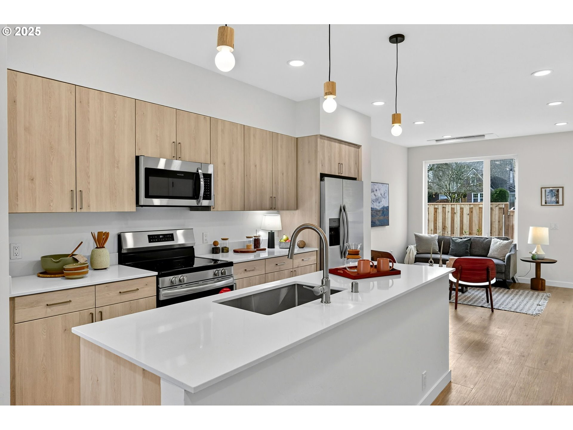 7208 Northeast Going Street Portland, OR 97218 - Photo 11 of 35 a kitchen with a sink a stove and chairs