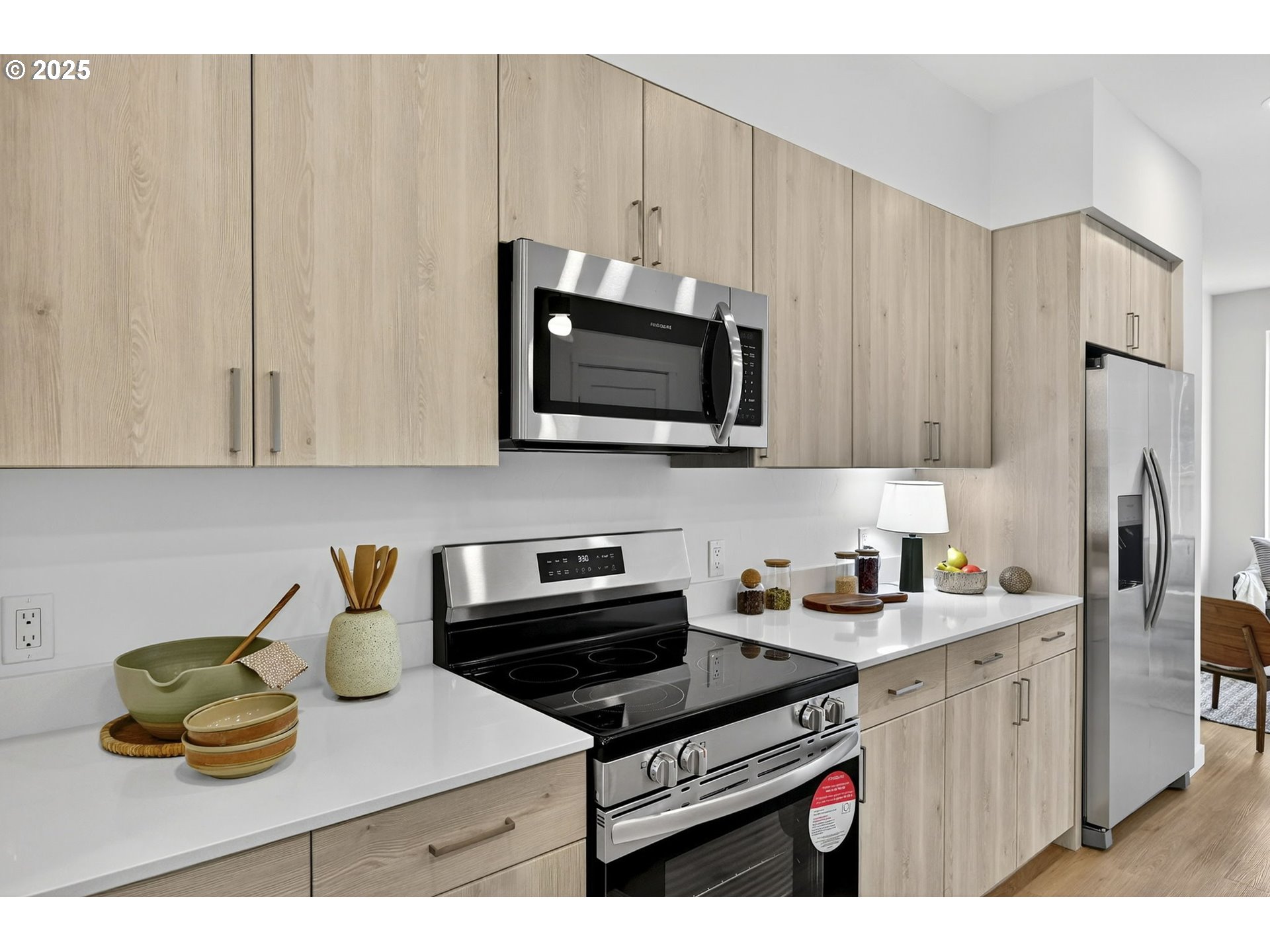 7208 Northeast Going Street Portland, OR 97218 - Photo 12 of 35 a kitchen with stainless steel appliances granite countertop a sink stove and microwave