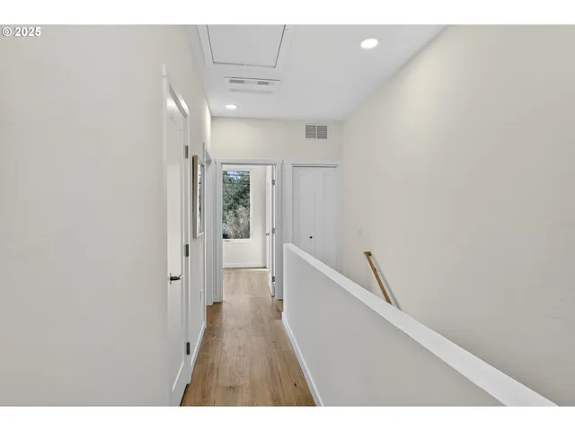 a bedroom with a large bed and a tv