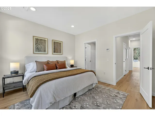 a bedroom with a large bed and a window