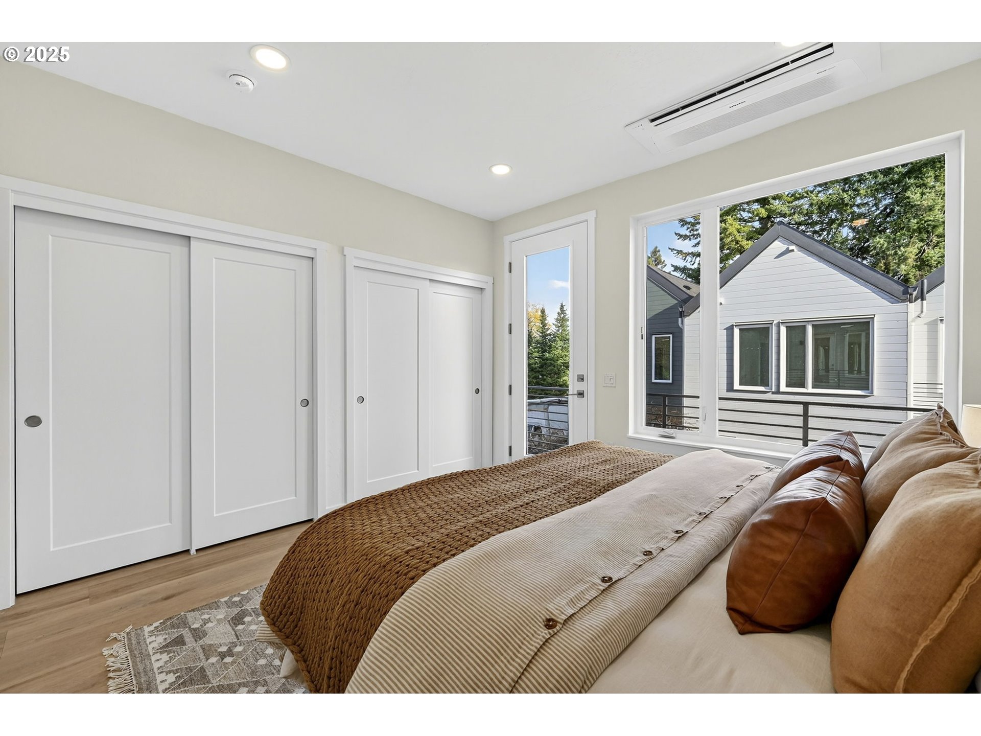 7208 Northeast Going Street Portland, OR 97218 - Photo 25 of 35 a bedroom with a large bed and a window