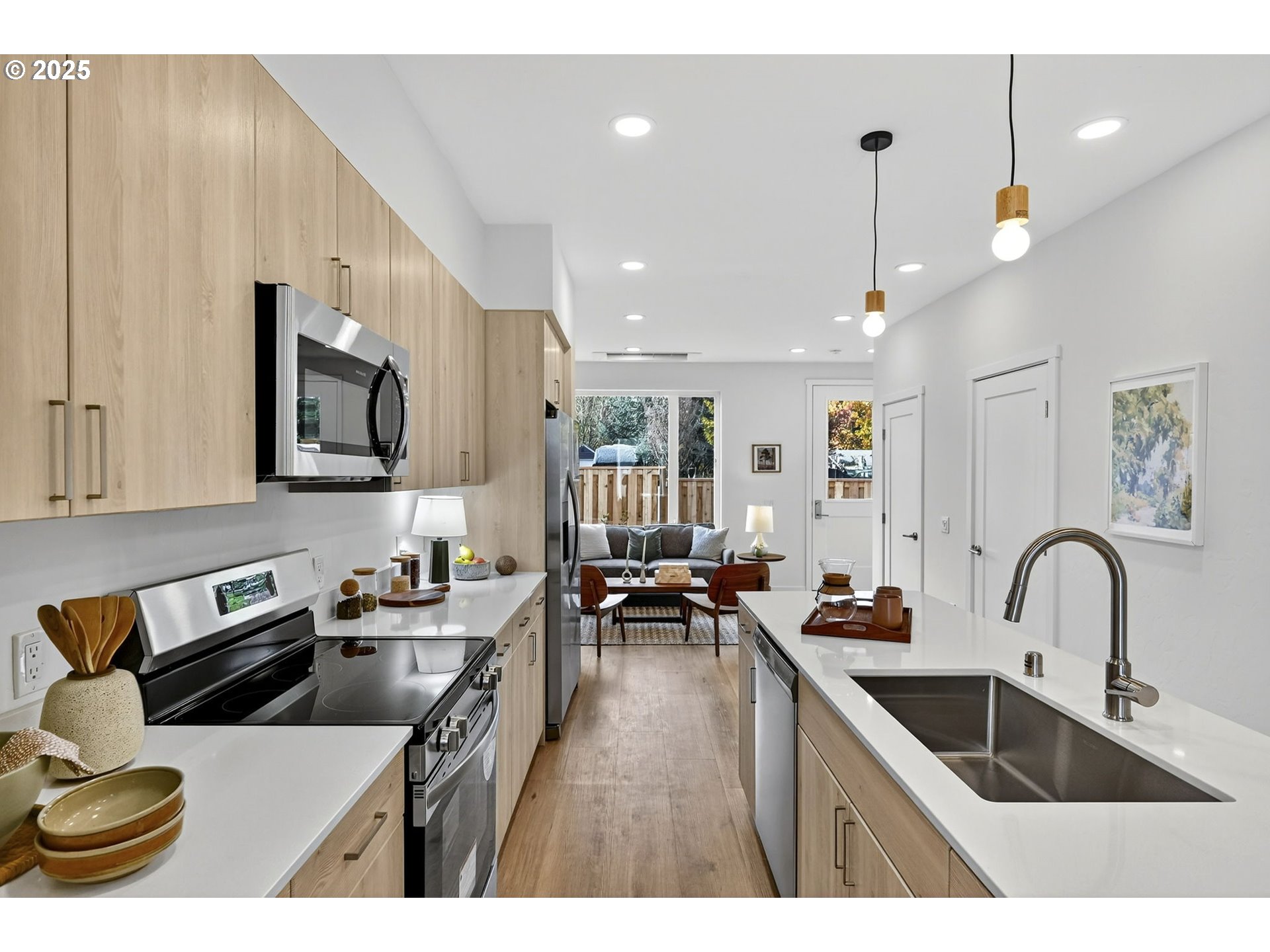 7208 Northeast Going Street Portland, OR 97218 - Photo 10 of 35 a kitchen with a sink a stove and cabinets