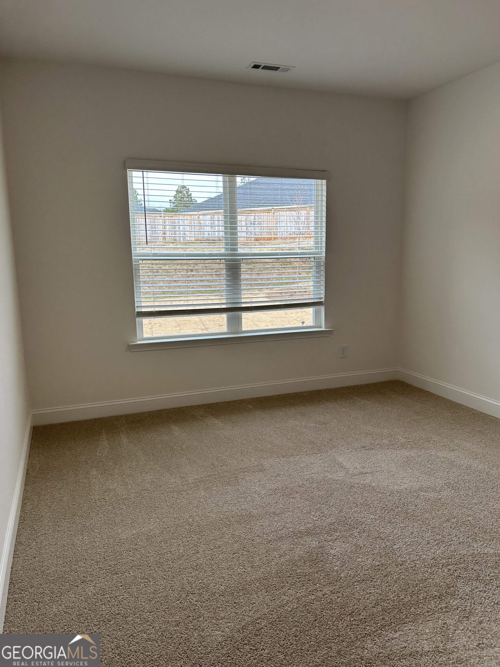 1409 Barrington Pl Way Macon, GA 31220 - Photo 12 of 17 an empty room with a window