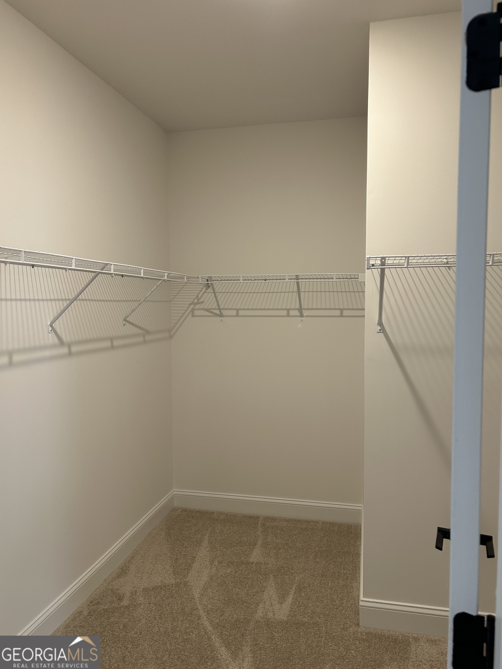 1409 Barrington Pl Way Macon, GA 31220 - Photo 14 of 17 a view of a room with racks on the wall
