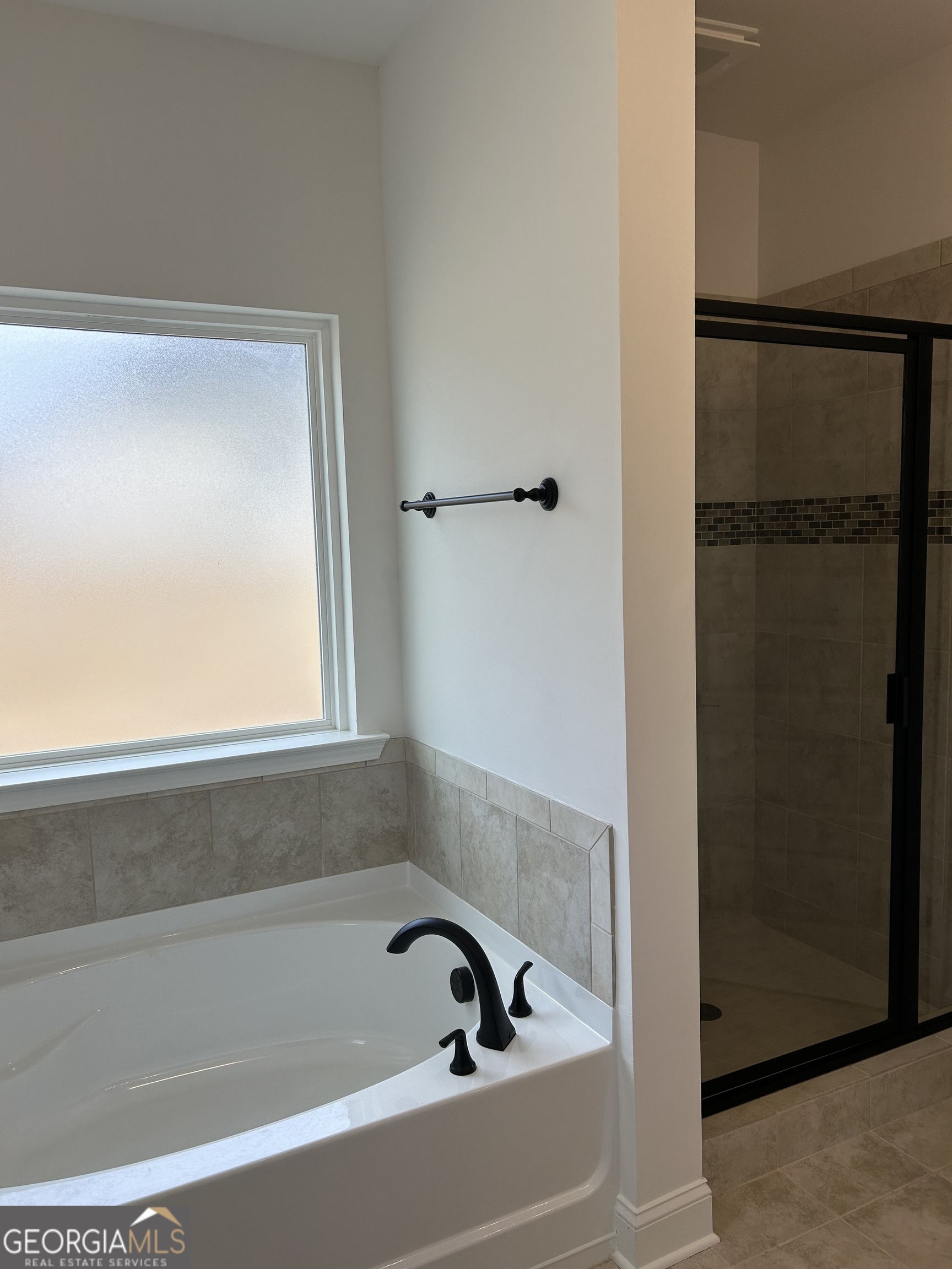 1409 Barrington Pl Way Macon, GA 31220 - Photo 17 of 17 a bathroom with a bathtub