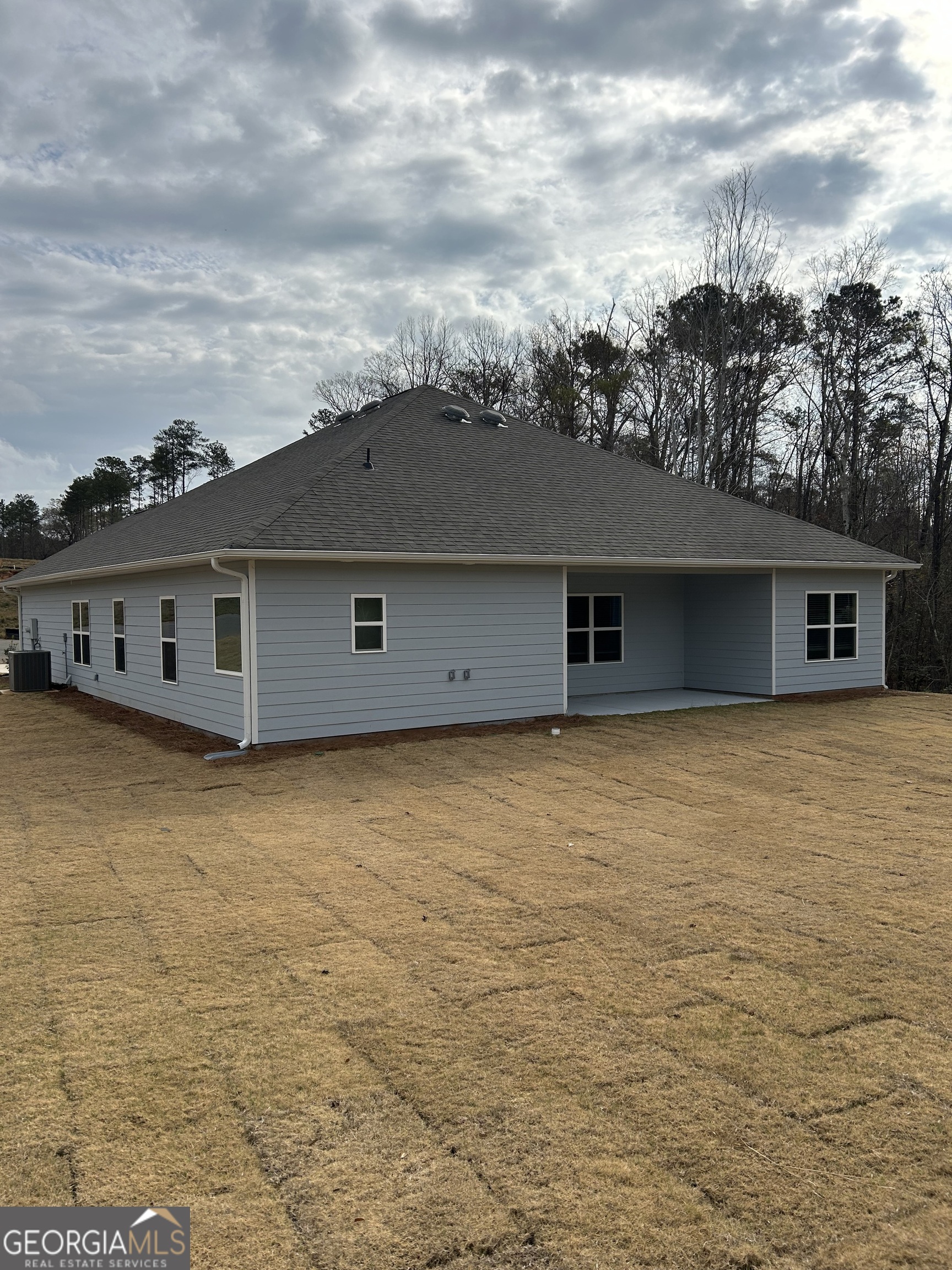 1409 Barrington Pl Way Macon, GA 31220 - Photo 4 of 17 an outdoor space with swimming pool in front of it