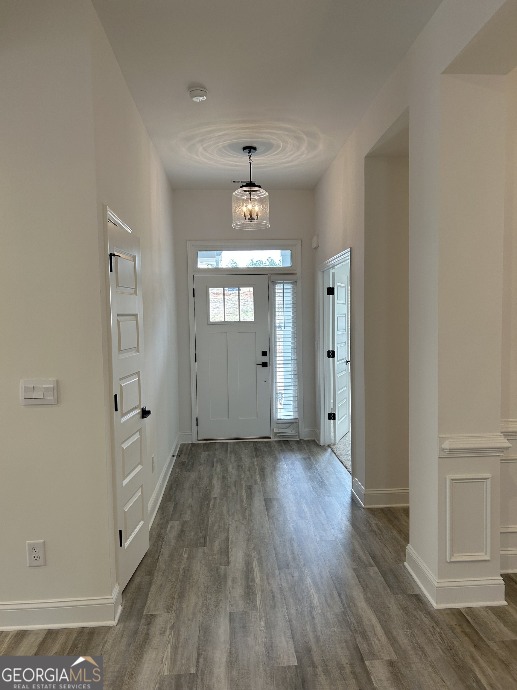 1409 Barrington Pl Way Macon, GA 31220 - Photo 5 of 17 wooden floor in an empty room with a window