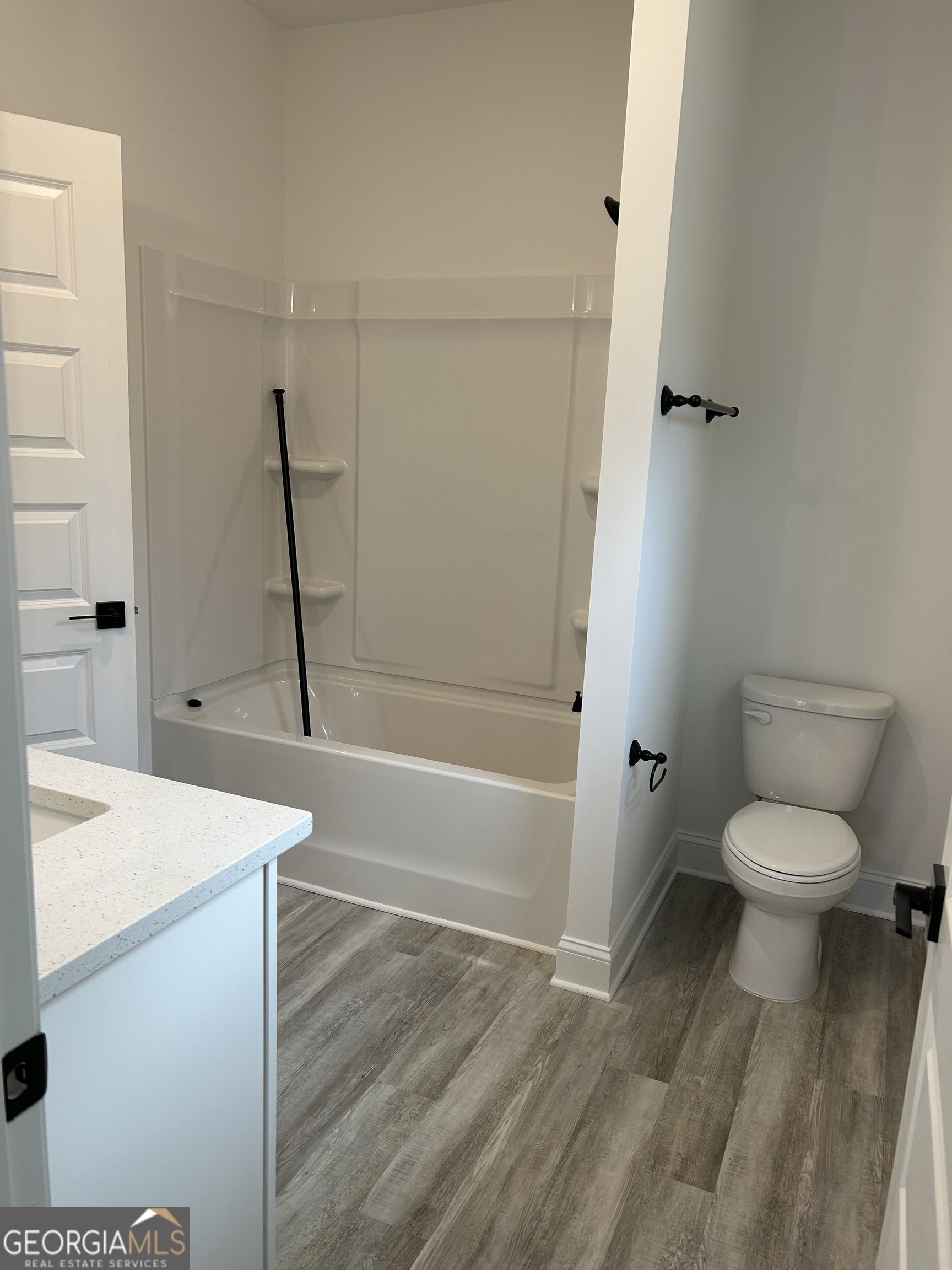 1409 Barrington Pl Way Macon, GA 31220 - Photo 8 of 17 a bathroom with a sink a toilet and a bathtub