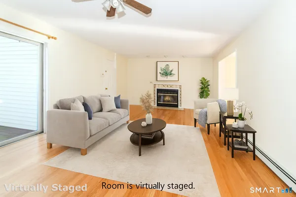 a bedroom with a large bed chandelier and a window