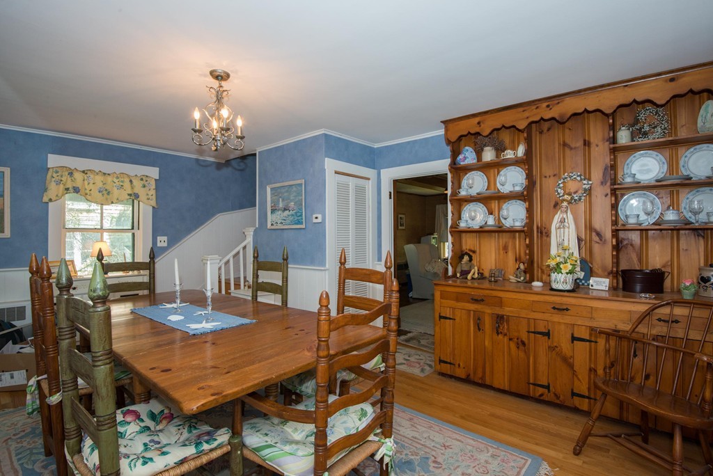 1 R Ticehurst Lane Marblehead, MA 01945 - Photo 3 of 21 a view of a dining room with furniture and chandelier