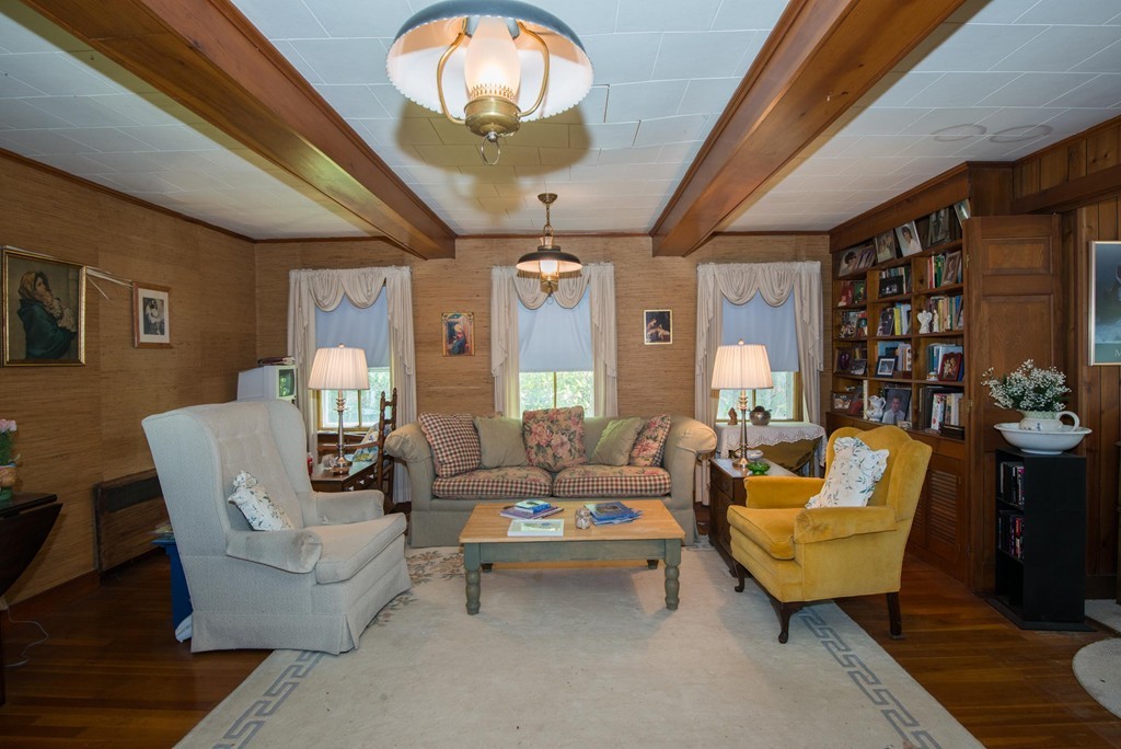 1 R Ticehurst Lane Marblehead, MA 01945 - Photo 7 of 21 a living room with furniture and a chandelier