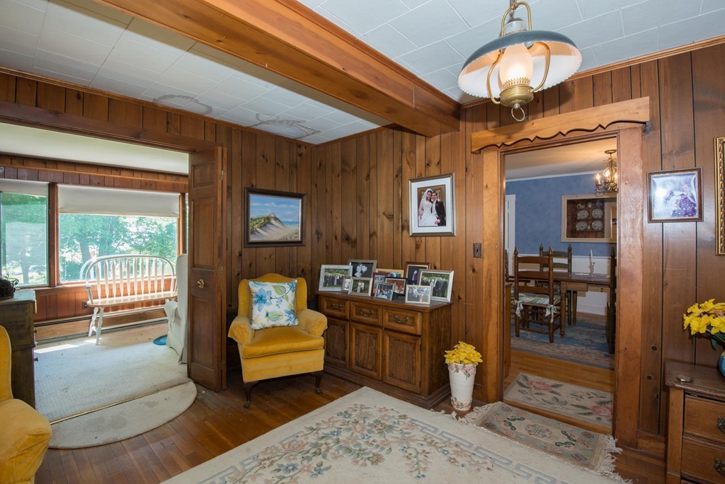 1 R Ticehurst Lane Marblehead, MA 01945 - Photo 9 of 21 a bedroom with furniture and a chandelier