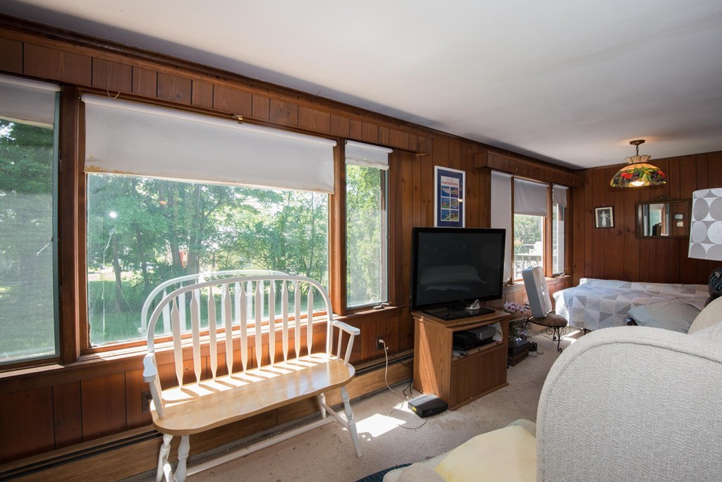 1 R Ticehurst Lane Marblehead, MA 01945 - Photo 10 of 21 a living room with furniture and a flat screen tv