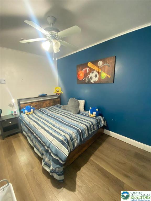 2268 Grove Road Allentown, PA 18109 - Photo 17 of 27 a bedroom with a bed and a chandelier