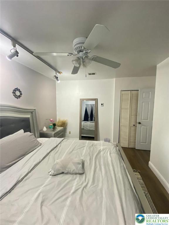 2268 Grove Road Allentown, PA 18109 - Photo 21 of 27 a bedroom with a bed and a chandelier