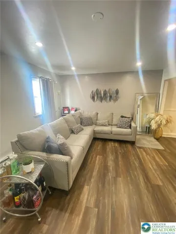 a living room with furniture and a couch