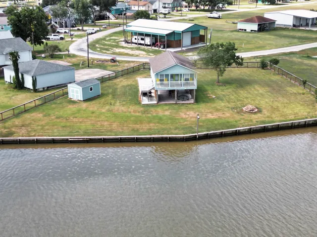 an aerial view of a house with swimming pool